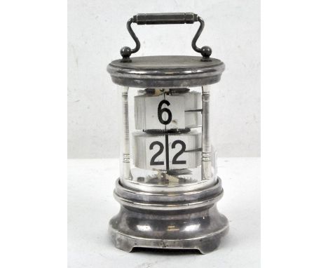 An early 20th century Chronos ticket clock of cylindrical white metal and glass, by Ever Ready, height without handle 12.5cm