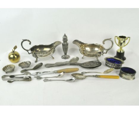 A collection of assorted silver plated wares, including two sauce boats, caddy spoon, flatware and more