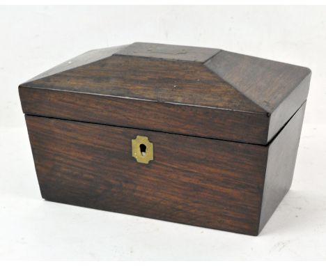 A Victorian rosewood tea caddy of sarcophagus form, the lid opening to reveal two lidded compartments, 20cm wide