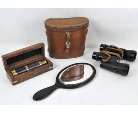 A vintage telescope in a box, a pair of Cosmos cased binoculars, and a hand mirror