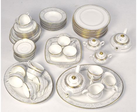 An extensive Royal Doulton tea and dinner service 'Naples' pattern, comprising plates, bowls, tea cups, tea pot and more