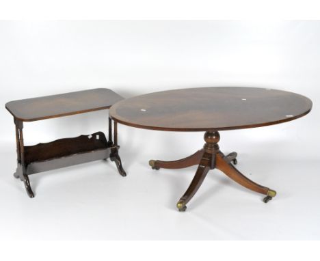 A mahogany oval coffee table, raised on a baluster column with four splayed legs on brass casters, 51cm x 120cm x 68cm, toget