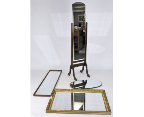A vintage cheval mirror with arched top, on splayed supports, height 165cm, an oval mirror with patterned bevelled edge, a gi