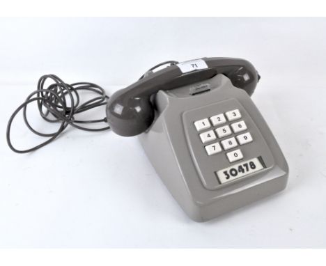 A grey vintage PO telephone, marked to base 2/764 GNA 79/2
