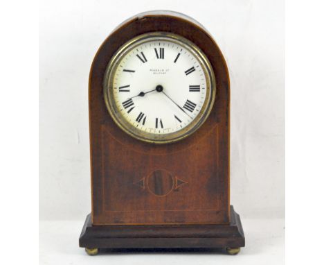 An early 20th century mahogany cased French mantel clock, retailed by Riddels Ltd Belfast, the enamel dial with Roman numeral