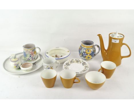 A collection of Poole pottery, including teapot, three tea cups and a sugar bowl, together with a vintage ceramic childs food