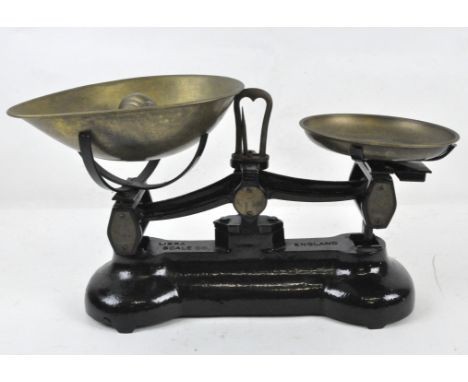 A set of black Libra Scale Co. weighing scales with brass dishes and weights, length 30cm