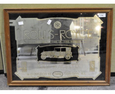 A vintage Rolls Royce advertising mirror in black and gold, 39cm x 54.5cm, framed