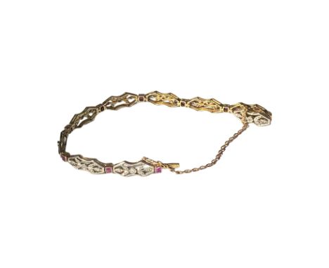 18ct gold and platinum diamond and ruby bracelet. French gold marks on clasp. The rubies are calibre cut and weight approxima