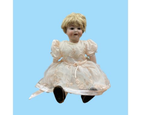 Large Bisque headed character toddler doll model number 126. With jointed composition body. Measuring approximately 66 cm in 