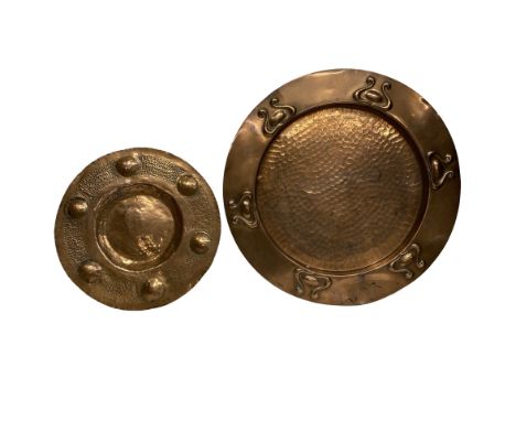 Two Arts and Crafts period copper chargers with typical design. Unmarked but very much in the Newlyn style Largest: 28.5 cms 