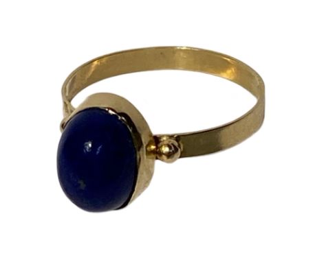 18ct gold and Lapis Lazuli cabochon ring. Egyptian marks but test 18ct gold.  Weighing approximately 2.5g. Size Q.  Condition