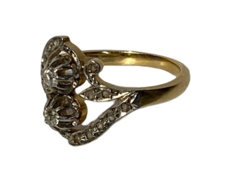 18ct gold and platinum French Belle Epoch ring. The Two larger diamonds weigh approximately 0.20ct and are old European cut. 