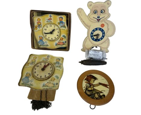 Three vintage nursery clocks together with a Swiss musical box. Two by Chad Valley, one 'Teddy SnowCrop'. All untested