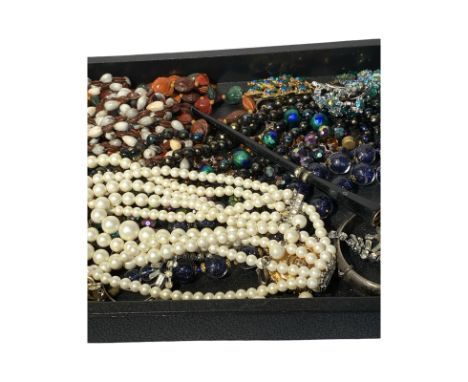 Mixed lot of costume jewellery to include: Various bead necklaces. Silver bangle Silver earrings Filigree silver brooch Victo