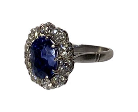 French platinum sapphire and diamond halo ring. The marks are on the outside of the band. The sapphire weighs approximate 1.3