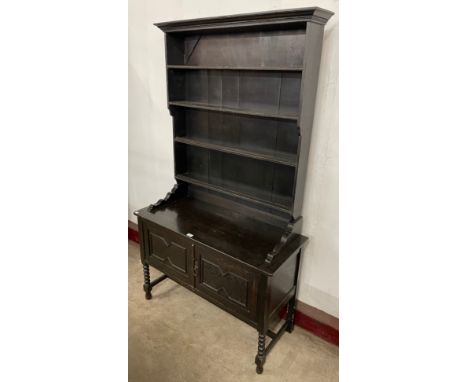 An early 20th Century oak bobbin turned dresser 