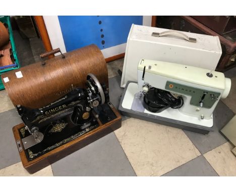 A cased Singer sewing machine and one other 