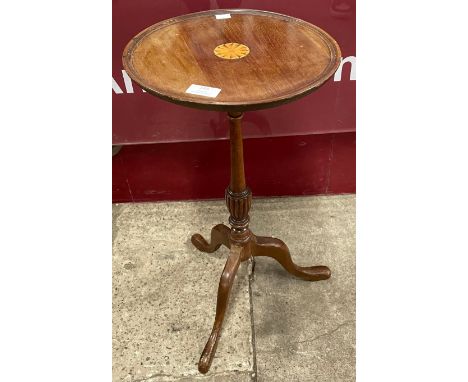 A Regency style inlaid mahogany tripod wine table 