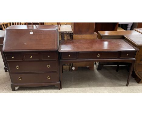 A Stag Minstrel mahognay bureau and a three drawer console table 