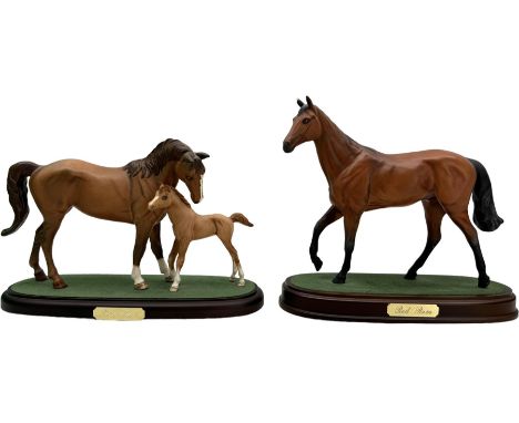 Royal Doulton model 'Red Rum', on a turned base, H22.5cm, together with a John Beswick group 'First Born', H18cm, both boxed 
