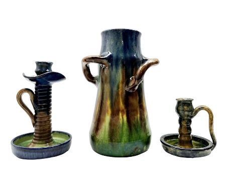 Three pieces of Art Nouveau pottery, probably Belgian, comprising a three-handled vase H28cm of tapered form, candlestick and