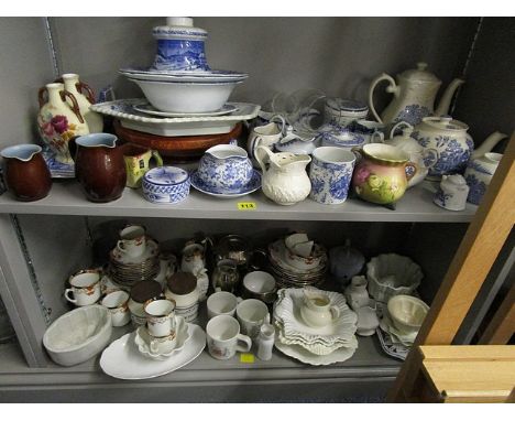 A mixed assortment of china to include a teaset, blue and white oil lamp and a Belgium art pottery wall plate and other items
