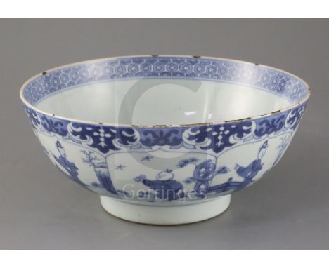 A Chinese blue and white petal lobed bowl, Kangxi period, the interior painted with a lady holding a fan beside a white hare 