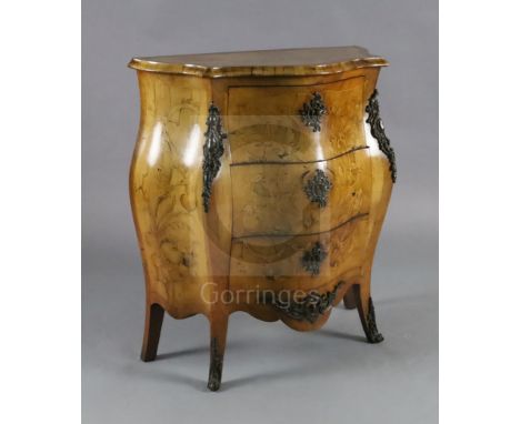 A late 19th century Dutch walnut and marquetry bombe commode, fitted three long drawers and inlaid with urns and flowering sc