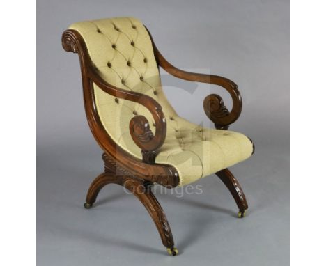 A good Regency mahogany library chair, in the manner of Thomas Hope, with button back and scroll arms on downswept legs, the 