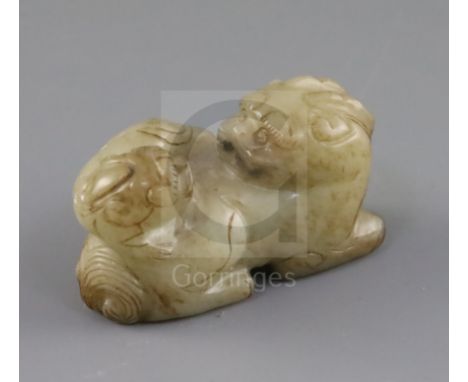 A Chinese pale celadon and brown jade group of a lion dog and cub, 18th / 19th century, L.6.3cm
