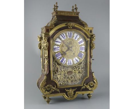 A 19th century French ormolu mounted red tortoiseshell mantel clock, with enamelled tablet numerals and eight day movement st