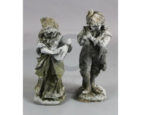 A pair of lead garden statues, modelled as a male horn player and female companion, H.1ft 10.5in.