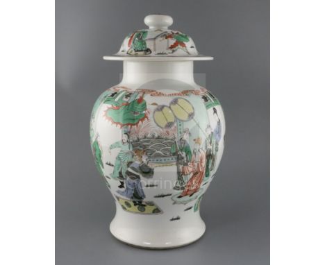 A large Chinese famille verte baluster vase and cover, late 19th century, painted with dignitaries in a pavilion garden to th