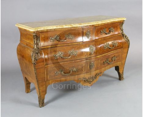 A Louis XV style kingwood bombe commode, with serpentine marble top, ormolu mounts, two short and two graduated long drawers,