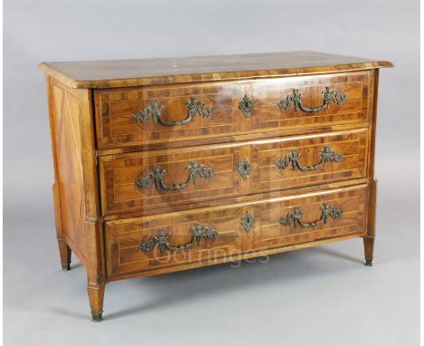 An 18th century German olivewood veneered commode with parquetry top and three long drawers fitted ormolu mounts, on squared 