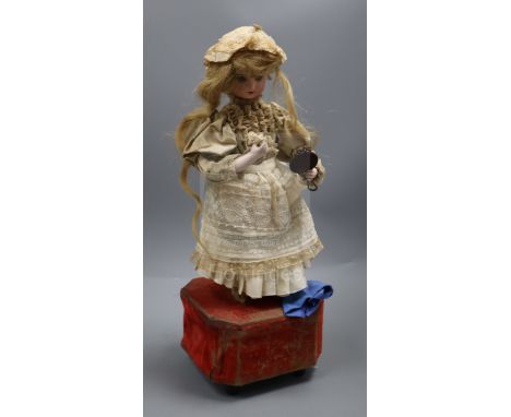 A Roullet et Decamps 'lady with powder puff and mirror' automaton with a closed mouth Jumeau head, with brown glass eyes, pie