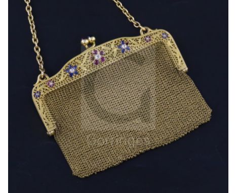 A French pierced 18ct gold, ruby, sapphire and diamond mesh evening purse, set with gem set floral motifs, the clasp set with