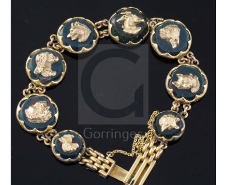 An early 20th century 9ct gold and bloodstone panel set bracelet, each stone mounted with a gold dog's head applique, includi