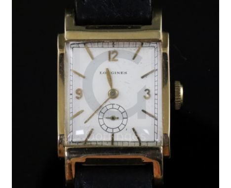 A gentleman's stylish 1930's? 14k gold Longines manual wind wrist watch, with raised lugs and rectangular baton and Arabic di