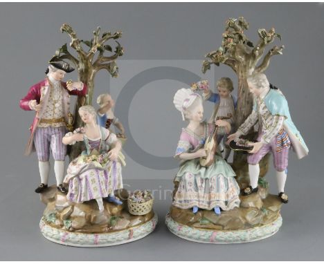 A pair of Meissen groups, late 19th century, the first modelled with a lady playing a mandolin and a gentleman with a hat of 