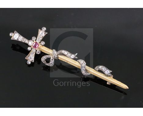 A late Victorian gold and silver, ruby, old and rose cut diamond set sword and ribbon bow brooch, 67mm.