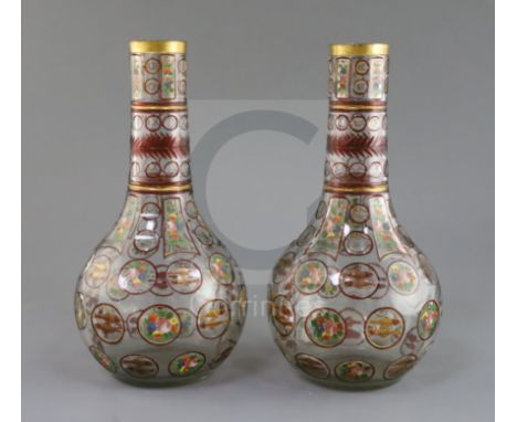 A pair of Bohemian Ottoman Market glass bottle vases, late 19th century, each enamelled and ruby flashed with panels of fish 