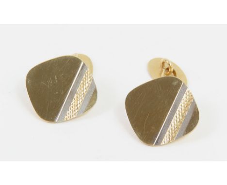 A pair of 9ct gold cufflinks, the square shaped panels with engine turned decoration and white gold accents across one corner