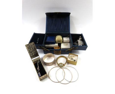 A Victorian gilt hinged bangle, a pair of white paste set screw back earrings, a marcasite set brooch in the form of a crown,
