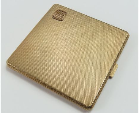 A 9ct gold pocket cigarette case, Chester, 1928, Cohen & Charles, of square slightly convex form, with cantered corners, deco