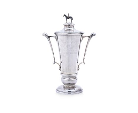 A PENANG TURF CLUB SILVER TROPHY CUP AND COVER
Garrard & Co., London 1983, tapering with twin handles, the lift off cover wit