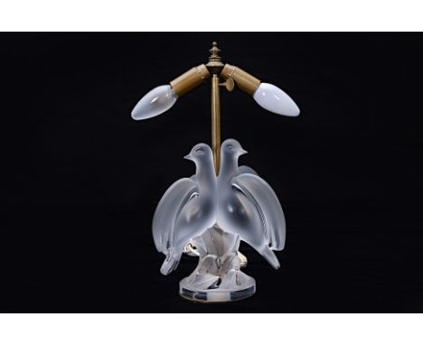 A LALIQUE 'ARIANE' FROSTED GLASS DOVES TABLE LAMP
France, crystal, two doves perched together facing outward, on circular bas