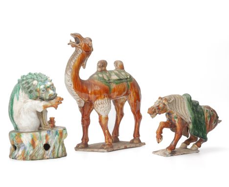 A GROUP OF THREE SANCAI GLAZED MODEL OF ANIMALS
In the Tang style, comprising: a camel, with its head raised; a horse; and a 