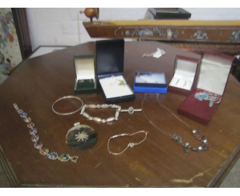 Selection of silver jewellery.